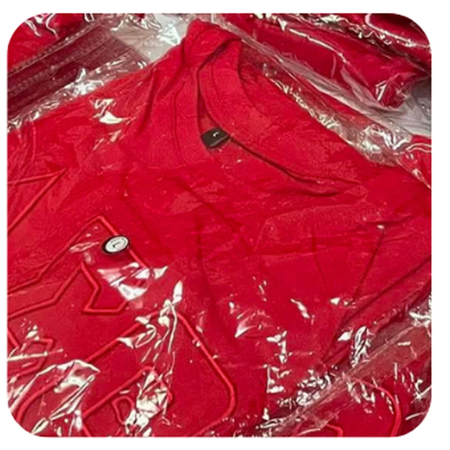 Red-on-red monochromatic DST appliqué tee with lighter red embroidered stitching