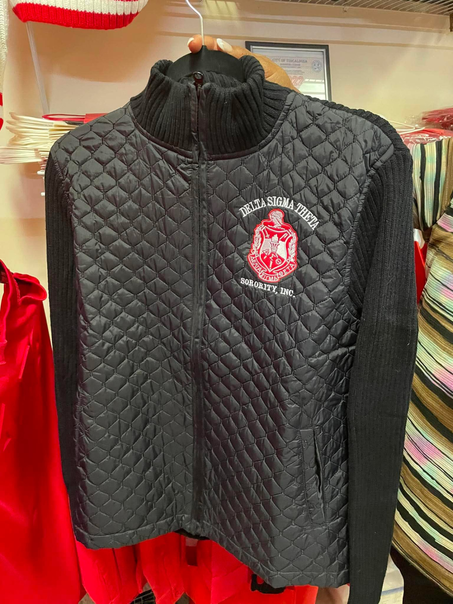 Black quilted jacket with Delta Sigma Theta crest