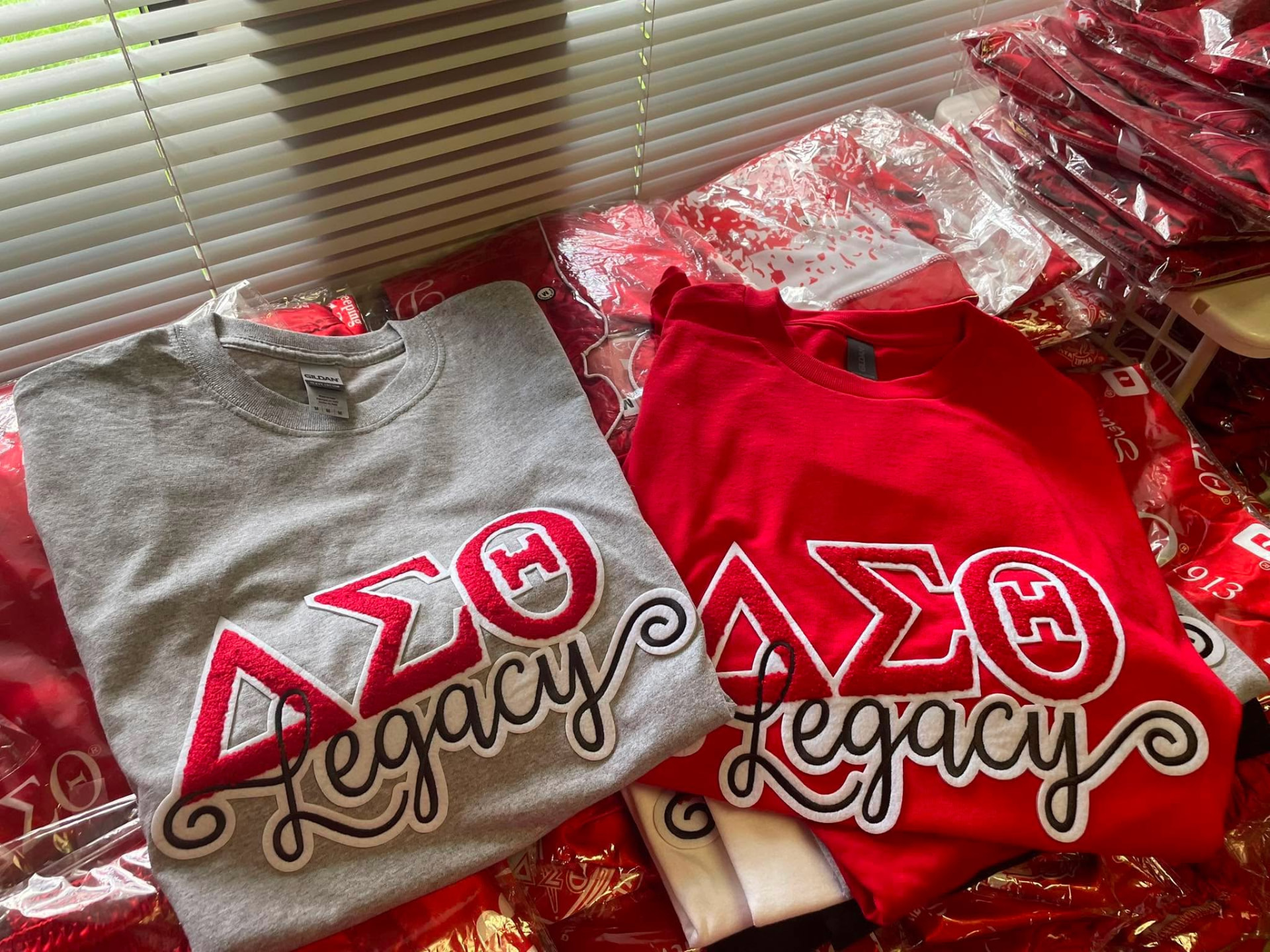 Gray and red Legacy applique crewneck tees