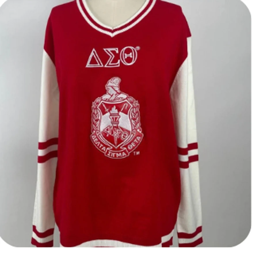 Crimson crewneck sweater with white sleeves, DST letters and crest