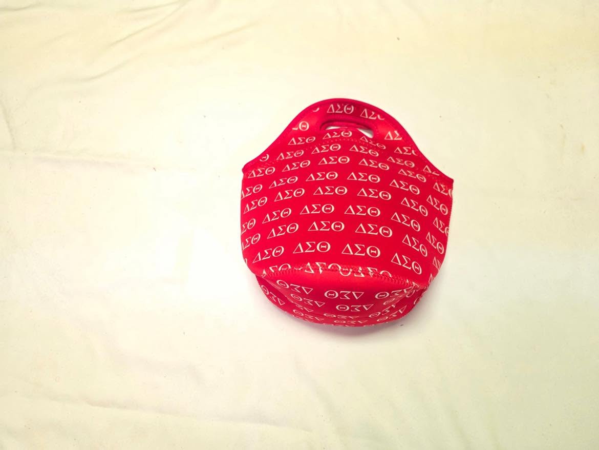 Small red tote covered in repeating white Delta Sigma Theta symbols