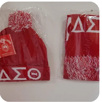 Red and white ΔΣΘ pom knit hat with matching fringed scarf